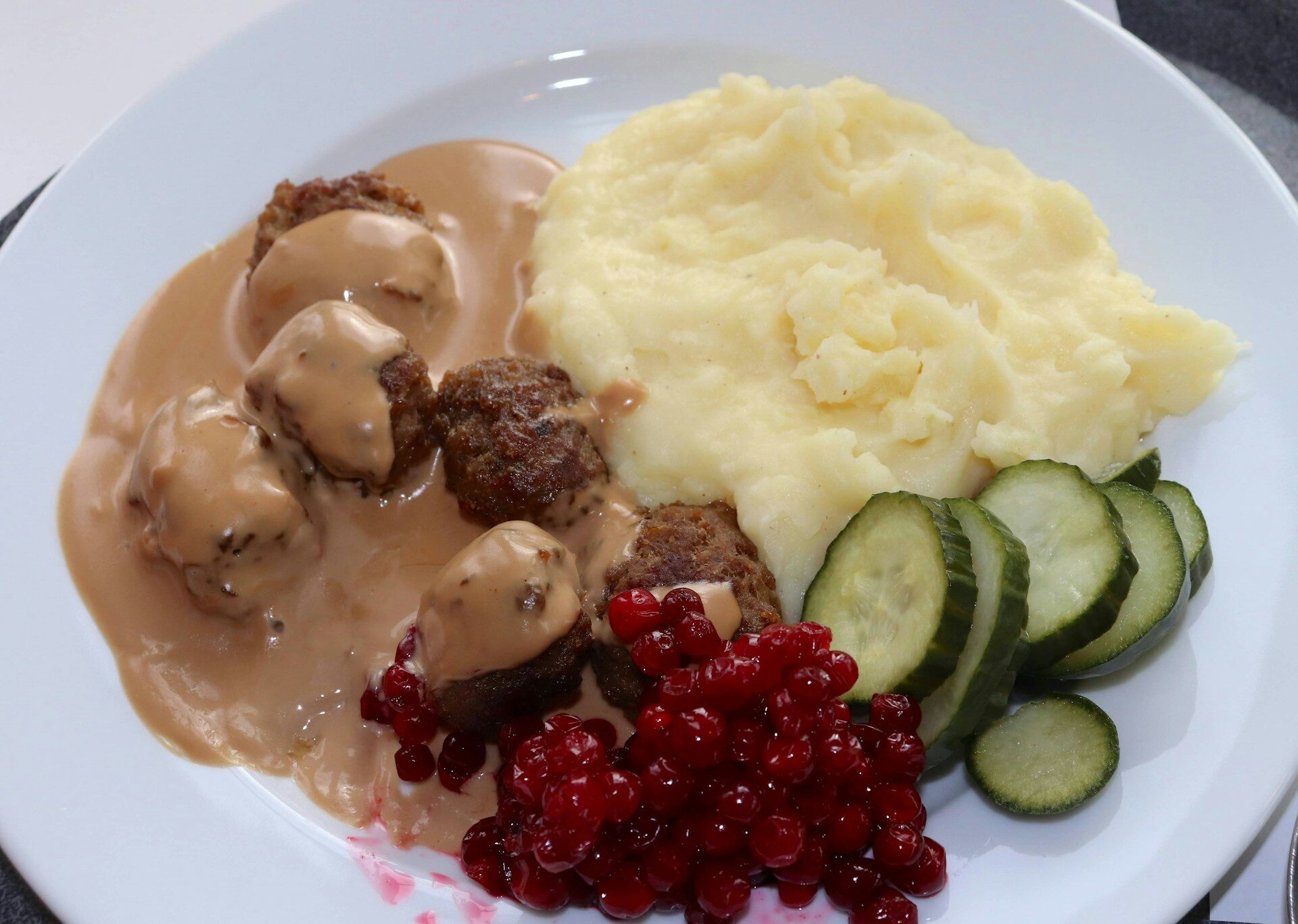 Swedish meatballs with cream sauce, lingonberries, and mashed potatoes